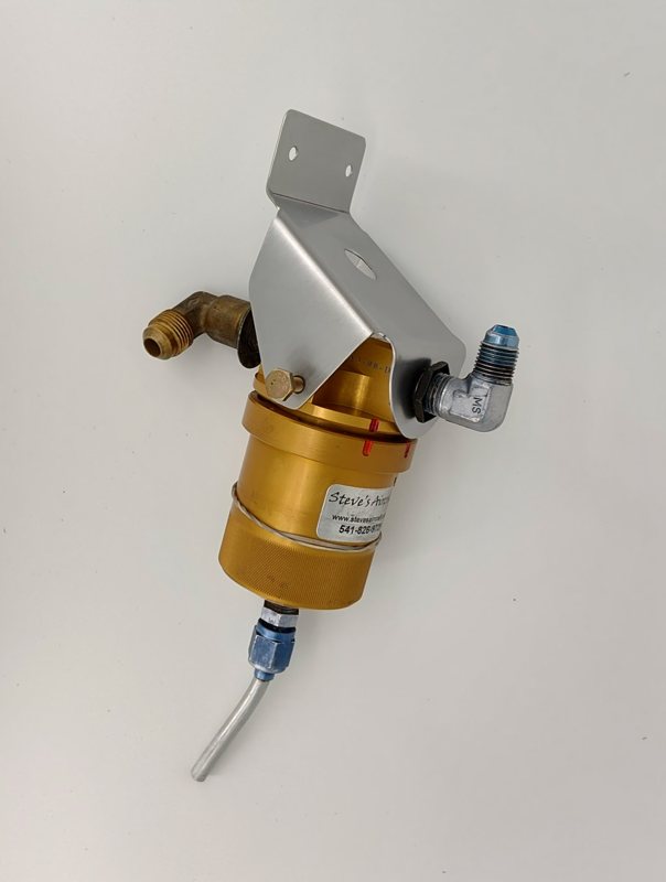 The bracket fitted to the gascolator with its fuel fittings